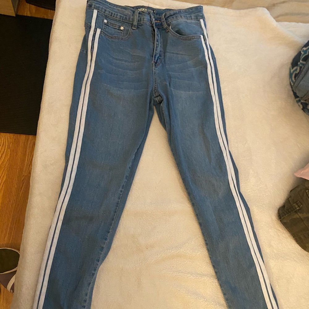 Blue jeans with white stripes on the side